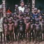 Children and a nurse attendant at a Nigerian orphanage in the la